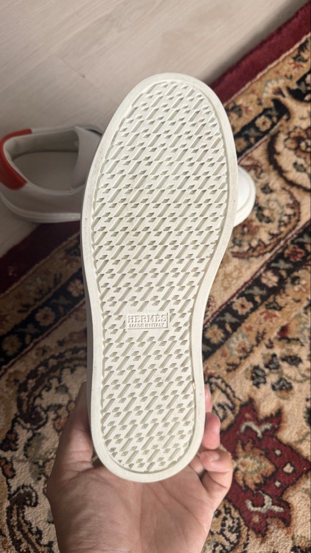 Hermès Quicker Sneaker White Orange Size 36 (Category: Sneakers) located in Paranaque City. Submitted by patrickkyl48122 (Listing ID 1469499655, Image 3). Description: Bought sa hermes greenbelt Srp 53k Selling for 20k nalang No inclusion 100% authentic 2x used only - Brand: Hermès - Model: Quicker Low-Top Sneakers - Size: 36 (stamped inside) - Color: White calfskin with iconic orange 'H' stripes and vibrant orange heel counters - Origin: Made in