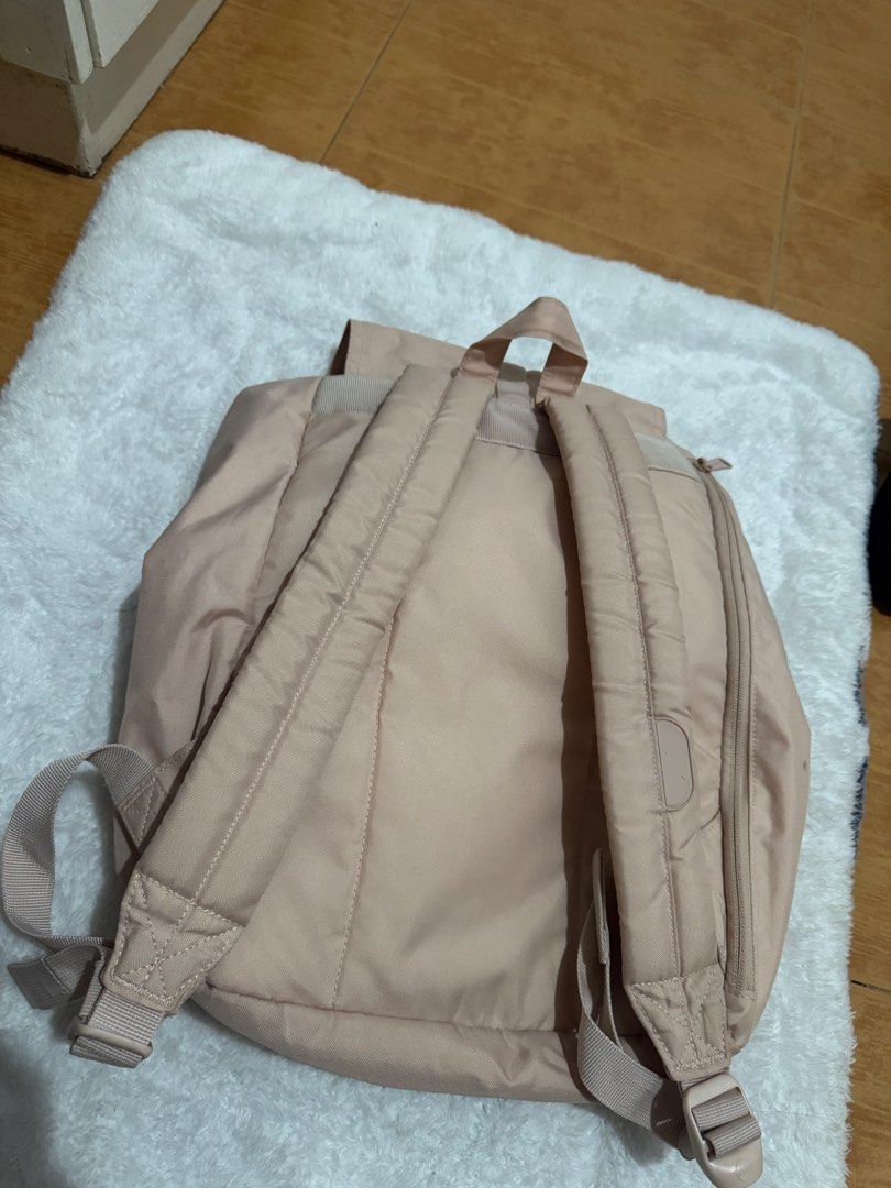Herschel beige backpack with front pockets and drawstring (Category: Backpacks) located in Manila. Submitted by silverbird.27280a (Listing ID 1469408072, Image 2). Description: ORIGINAL Herschel backpack in classic beige - Dual front pockets with secure buckle straps - Drawstring main compartment with top flap closure - Comfortable, padded shoulder straps - Condition: Clean inside with minor exterior marks/dirt from regular use - Perfect for dail
