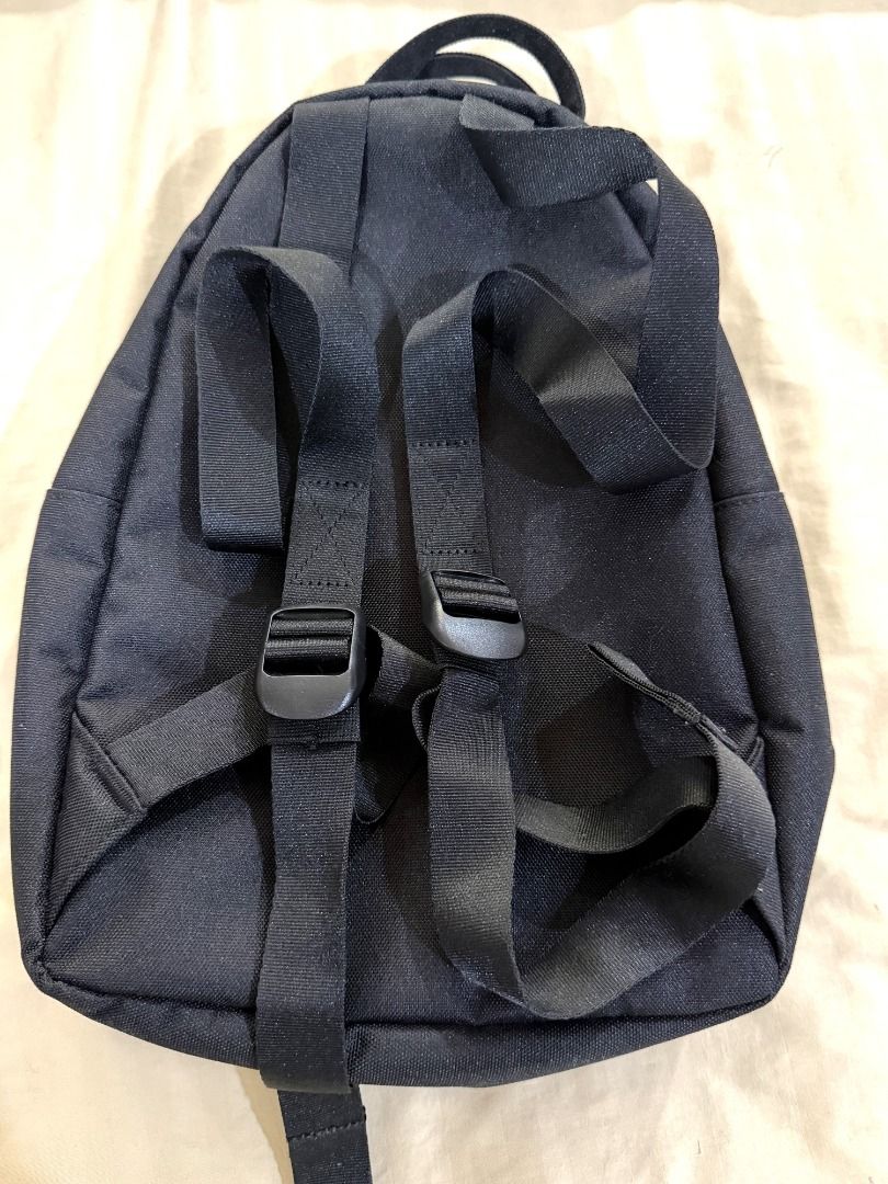 Herschel Classic Mini Backpack, Black (Lightly Used) (Category: Backpacks) located in Makati City. Submitted by cheenaroonie (Listing ID 1469422116, Image 3). Description: Black Herschel mini backpack, lightly used and still in excellent condition. • Front zip pocket with gold zipper and engraved Herschel pull • Main zip compartment with striped lining and an inside slip pocket • Adjustable shoulder straps + top grab loop • Small and light, good 