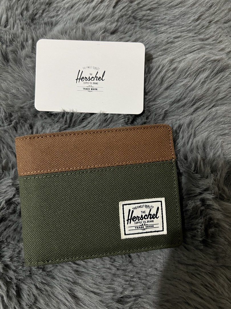 Herschel Roy Wallet RFID Green Brown (Category: Luxury Bags & Wallets) located in Manila. Submitted by yiaharris215077 (Listing ID 1469474464, Image 1). Description: Authentic Herschel Roy Wallet in green and brown canvas. Features RFID protection, multiple card slots, a cash compartment, and the original tag..