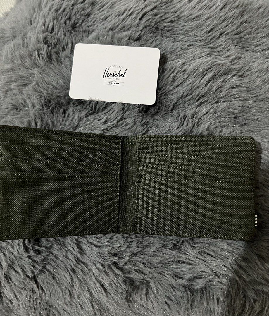 Herschel Roy Wallet RFID Green Brown (Category: Luxury Bags & Wallets) located in Manila. Submitted by yiaharris215077 (Listing ID 1469474464, Image 2). Description: Authentic Herschel Roy Wallet in green and brown canvas. Features RFID protection, multiple card slots, a cash compartment, and the original tag..