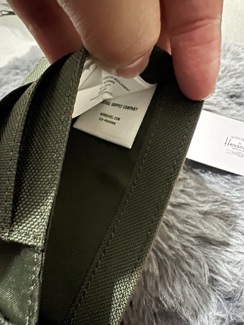 Herschel Roy Wallet RFID Green Brown (Category: Luxury Bags & Wallets) located in Manila. Submitted by yiaharris215077 (Listing ID 1469474464, Image 3). Description: Authentic Herschel Roy Wallet in green and brown canvas. Features RFID protection, multiple card slots, a cash compartment, and the original tag..