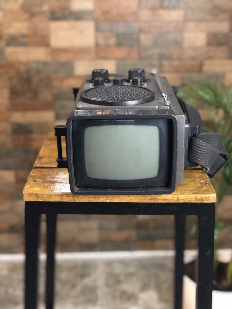 Hitachi Mark 5 IC Transistor Portable CRT TV (Category: TV) located in Caloocan City. Submitted by BrixGarcia (Listing ID 1468792542, Image 3). Description: - Vintage Hitachi Mark 5 portable television and radio combo - Stylish dark grey plastic casing with built-in strap and extendable antenna - Rotary dials for VHF/UHF tuning, contrast, brightness, and volume - Fully functional screen that turns on with a clear black and white picture - Perfect