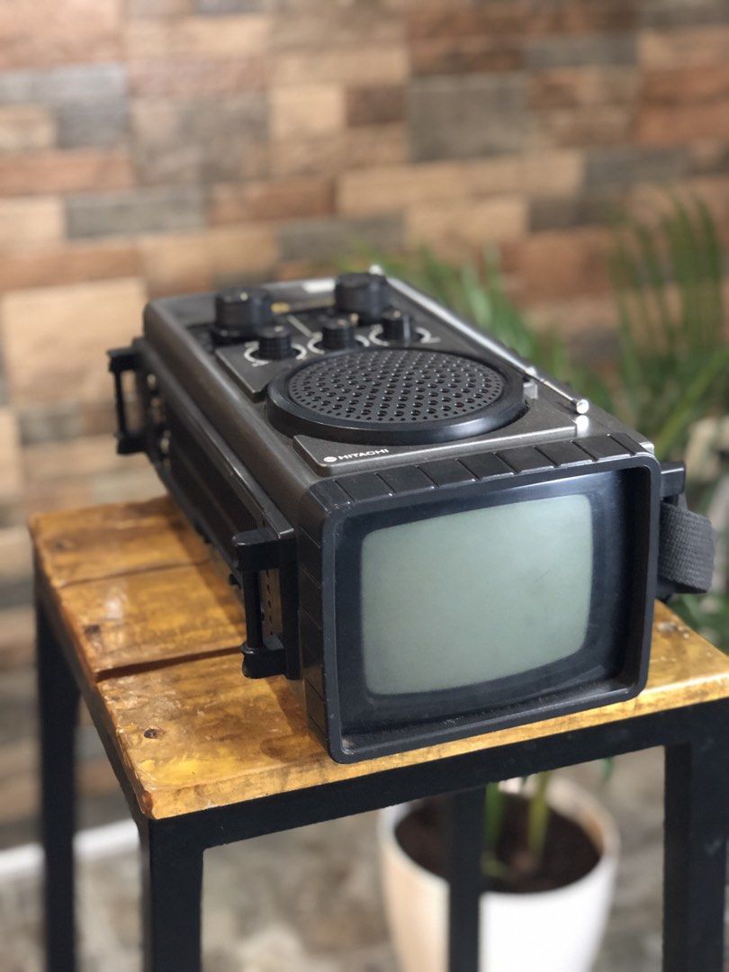 Hitachi Mark 5 IC Transistor Portable CRT TV (Category: TV) located in Caloocan City. Submitted by BrixGarcia (Listing ID 1468792542, Image 1). Description: - Vintage Hitachi Mark 5 portable television and radio combo - Stylish dark grey plastic casing with built-in strap and extendable antenna - Rotary dials for VHF/UHF tuning, contrast, brightness, and volume - Fully functional screen that turns on with a clear black and white picture - Perfect