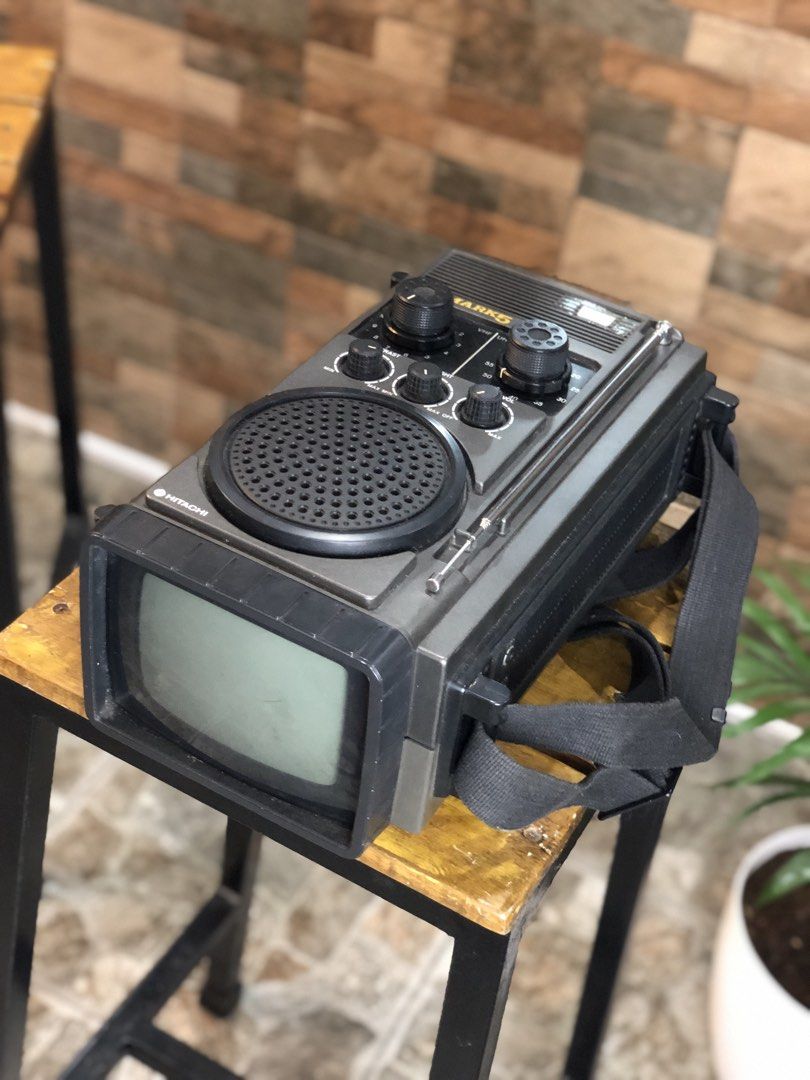 Hitachi Mark 5 IC Transistor Portable CRT TV (Category: TV) located in Caloocan City. Submitted by BrixGarcia (Listing ID 1468792542, Image 2). Description: - Vintage Hitachi Mark 5 portable television and radio combo - Stylish dark grey plastic casing with built-in strap and extendable antenna - Rotary dials for VHF/UHF tuning, contrast, brightness, and volume - Fully functional screen that turns on with a clear black and white picture - Perfect
