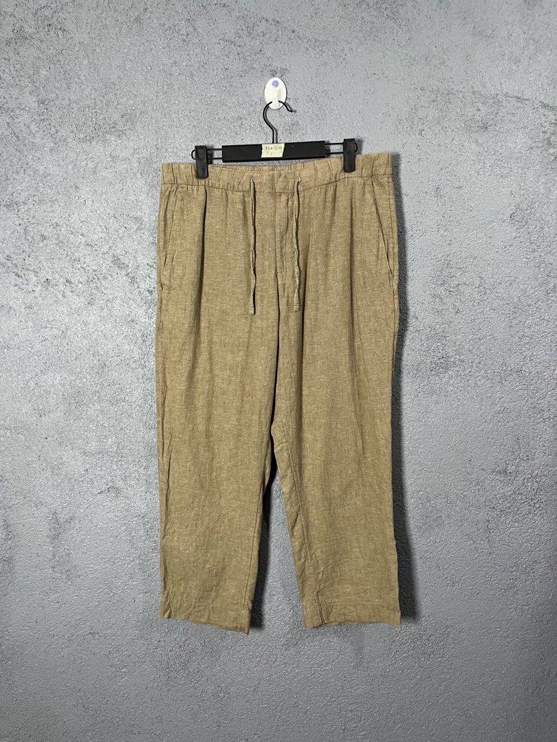 H&M Beige Linen Cotton Drawstring Pants Size S (Category: Trousers) located in Famy. Submitted by basicthrifted (Listing ID 1469404601, Image 1). Description: - Color: Versatile beige - Material: Breathable 55% linen and 45% cotton blend - Fit: Relaxed fit with an elastic waistband and adjustable drawstring - Features: Convenient side pockets - Origin: Made in Bangladesh - Style Tip: Great for pairing with casual shirts in warm weather.