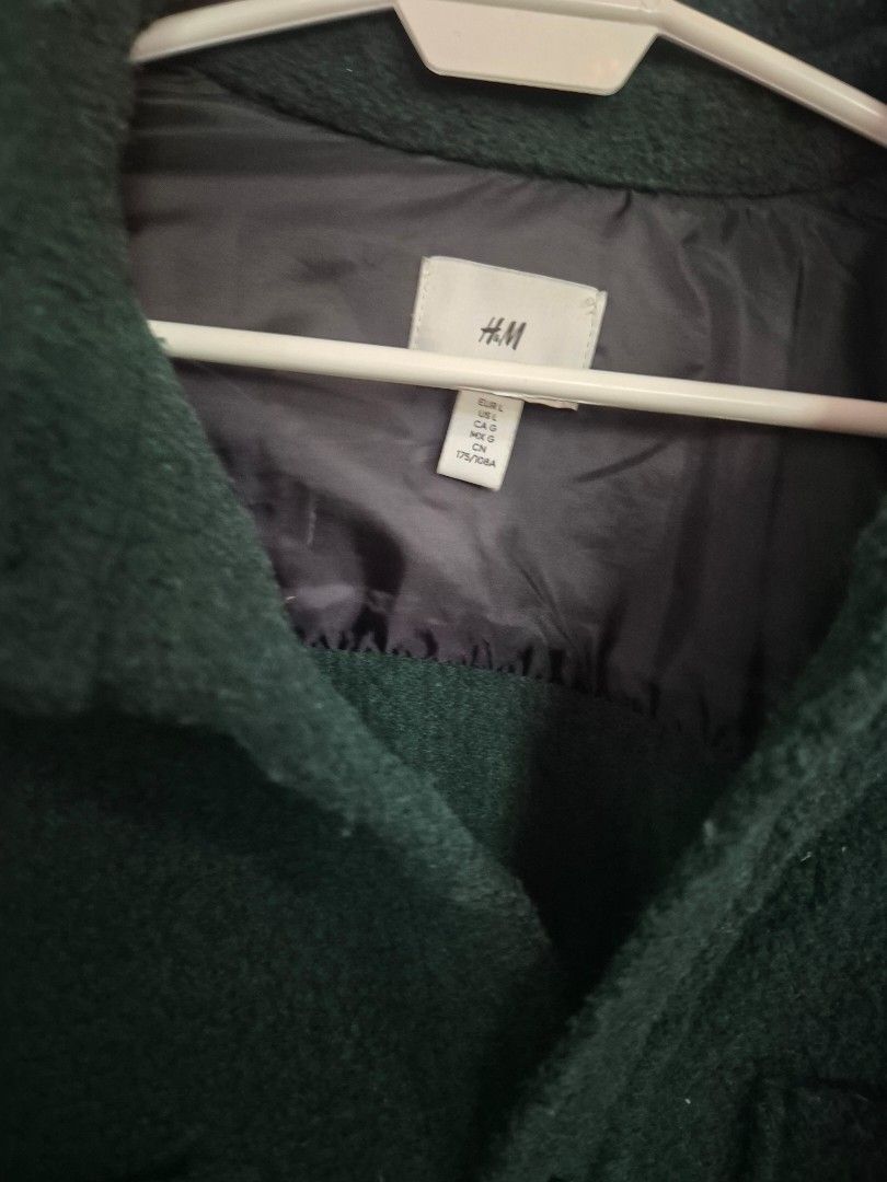 H&M Green Textured Relaxed Fit Jacket (Category: Coats, Jackets and Outerwear) located in Paranaque City. Submitted by monicaboo (Listing ID 1469408871, Image 3). Description: - Brand/Model: H&M Dark Green Textured Jacket - Size: Large - Fit: Relaxed fit - Details: Classic collar, button-up front closure, and two front chest pockets with button flaps - Lining: Fully lined with a sleek black satin finish - Style: Warm and versatile outerwear, perf