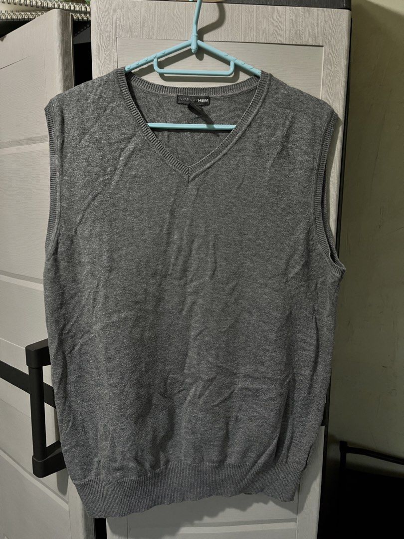 H&M Grey V-Neck Knit Sweater Vest (Category: Sleeveless) located in Baguio. Submitted by gbwardrobe (Listing ID 1469506739, Image 1). Description: Selling low because im decluttering pls dont offer an even lower price..