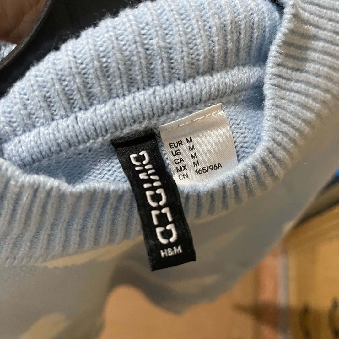 H&M Light Blue Butterfly Knit Sweater (Category: Longsleeves) located in Antipolo. Submitted by annedeclutterss (Listing ID 1469463333, Image 2). Description: - Color: Light blue with all-over white butterfly pattern - Fit: Cropped fit with pullover style - Neckline: Mock neck collar - Sleeves: Long sleeves - Material: Super soft and comfortable - Perfect for: Casual chilly days and pairing with jeans.