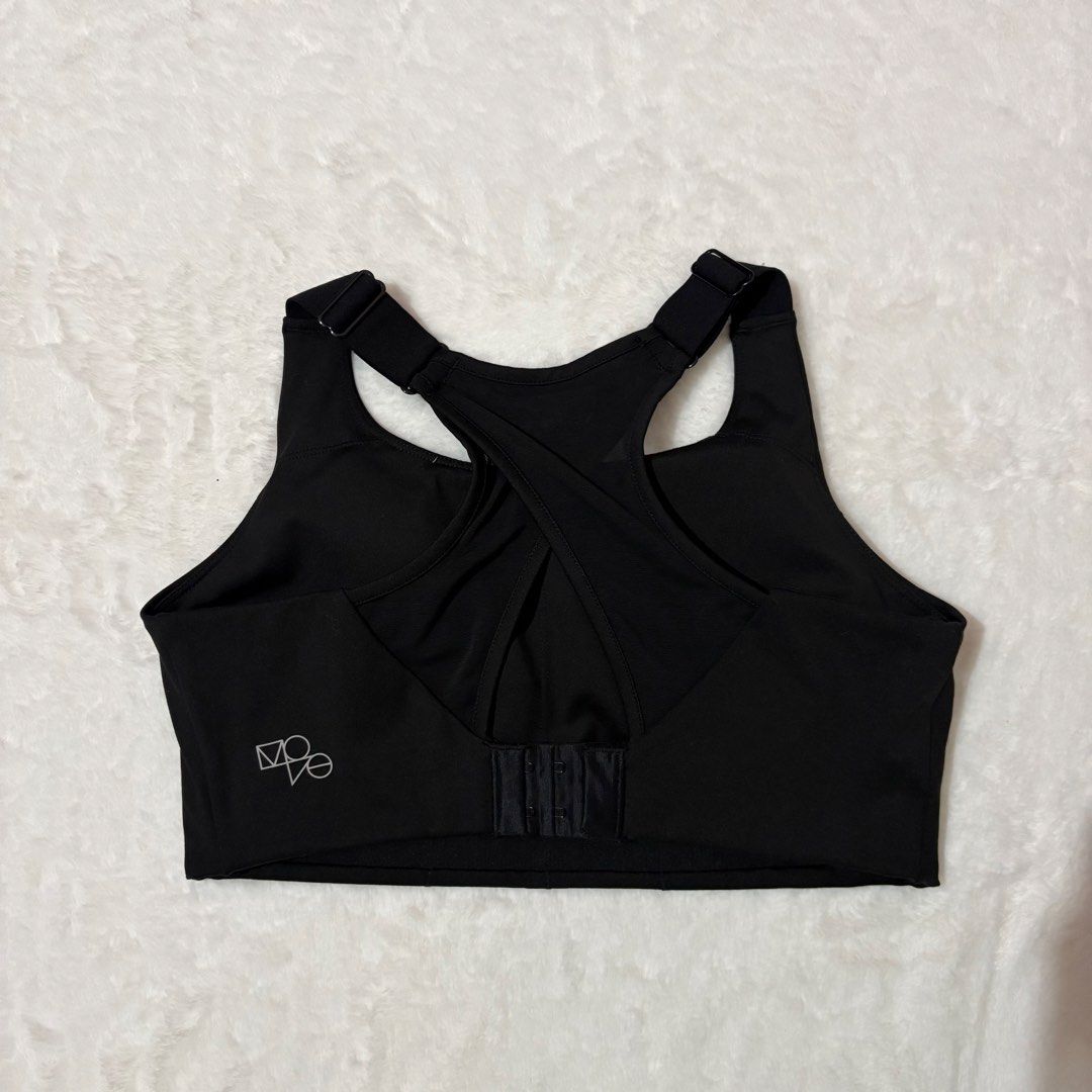 H&M Move Black Sports Bra Medium (Category: Activewear) located in Manila. Submitted by eandbshoppe_ (Listing ID 1469487699, Image 2). Description: - Brand: H&M Move - Color: Black - Size: Medium (EUR, US, CA, CN, MX) - Closure: Adjustable straps with hook-and-eye back closure - Design: Breathable mesh back paneling with criss-cross straps - Detail: Small H&M Move logo near bottom band.