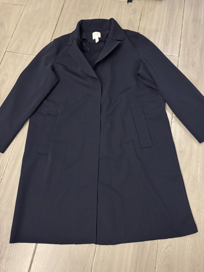 H&M Navy Blue Trench Coat Size 40P (Category: Coats, Jackets and Outerwear) located in Taguig. Submitted by sqaumejada (Listing ID 1469414248, Image 1). Description: - Brand: H&M - Color: Dark Blue - Size: EUR 40P / US 8P / UK 12P / CN 160/92A (Petite fit) - Design: Simple lapel collar, long sleeves, and two front pockets - Material: 95% polyester, 5% elastane (Shell); 100% polyester (Pocket lining) - Care: Machine washable at 40 degrees - Condit