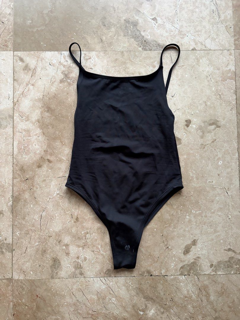 H&M Open-Back One-Piece Swimsuit: Black (Category: Bikinis & Swimsuits) located in Quezon City. Submitted by tidyup.lara (Listing ID 1469569825, Image 1). Description: EUR/US XS (CN 160/80A) Bust 23” Waist 23” Length 25” Condition 9/10: good as new but with washable stain.