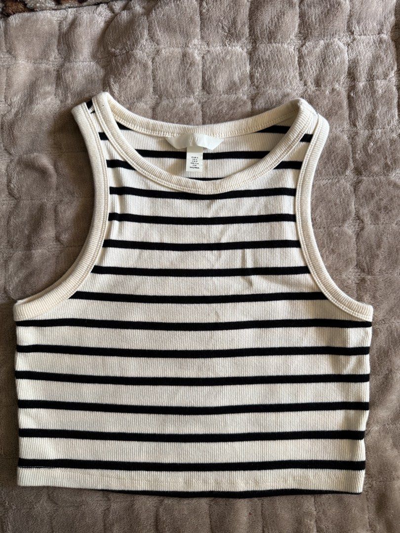 H&M Ribbed Crop Top (Category: Sleeveless) located in Quezon City. Submitted by 7th.avenue_closet (Listing ID 1469502587, Image 1). Description: - Brand: H&M - Size: S - Design: Black and white striped, classic crew neck, racerback cut - Material: Ribbed - Shipping: Ships via J&T Express.