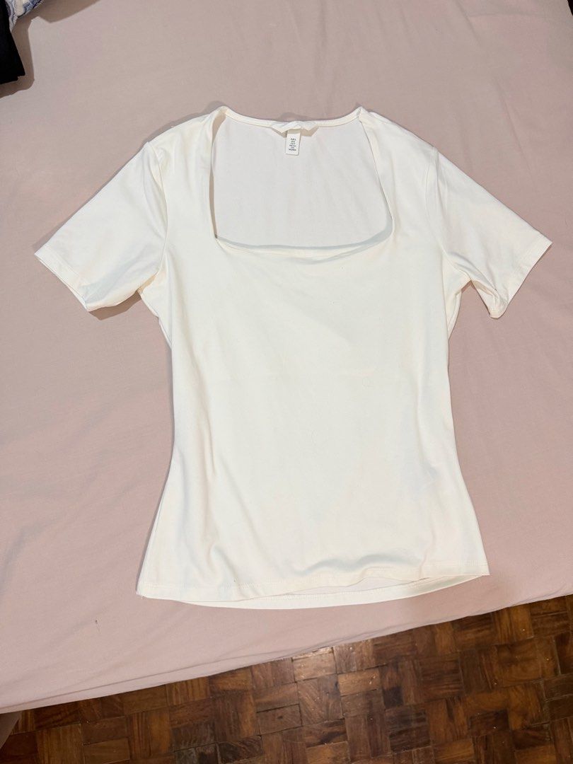 H&M White Square Neck Short Sleeve Top (Category: Shirts) located in Paranaque City. Submitted by hannahking36 (Listing ID 1469551079, Image 1). Description: - Brand: H&M - Color: White - Size: S (EUR S, US S, 160/88A) - Style: Short sleeve with square neckline - Fabric: Stretchy, snug fit - Condition: Clean, like new with no flaws - Perfect everyday basic top.