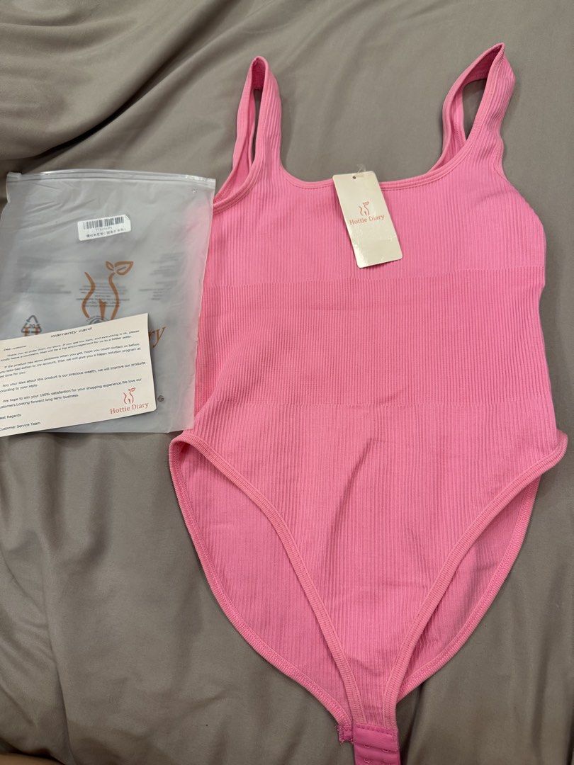 Hottie Diary Pink Ribbed Square Neck Bodysuit (Category: Sleeveless) located in San Fernando. Submitted by jelajoybasco (Listing ID 1469470714, Image 1). Description: - Hottie Diary pink bodysuit. - Ribbed texture material, square neckline,sleeveless tank style. - Bottom snap button closure. - Brand new in original frosted ziplock packaging, tag still attached. - Bright pink shade, stretchy fit. RFS : Wrong size din, dalawa sila binili ko tapoa m