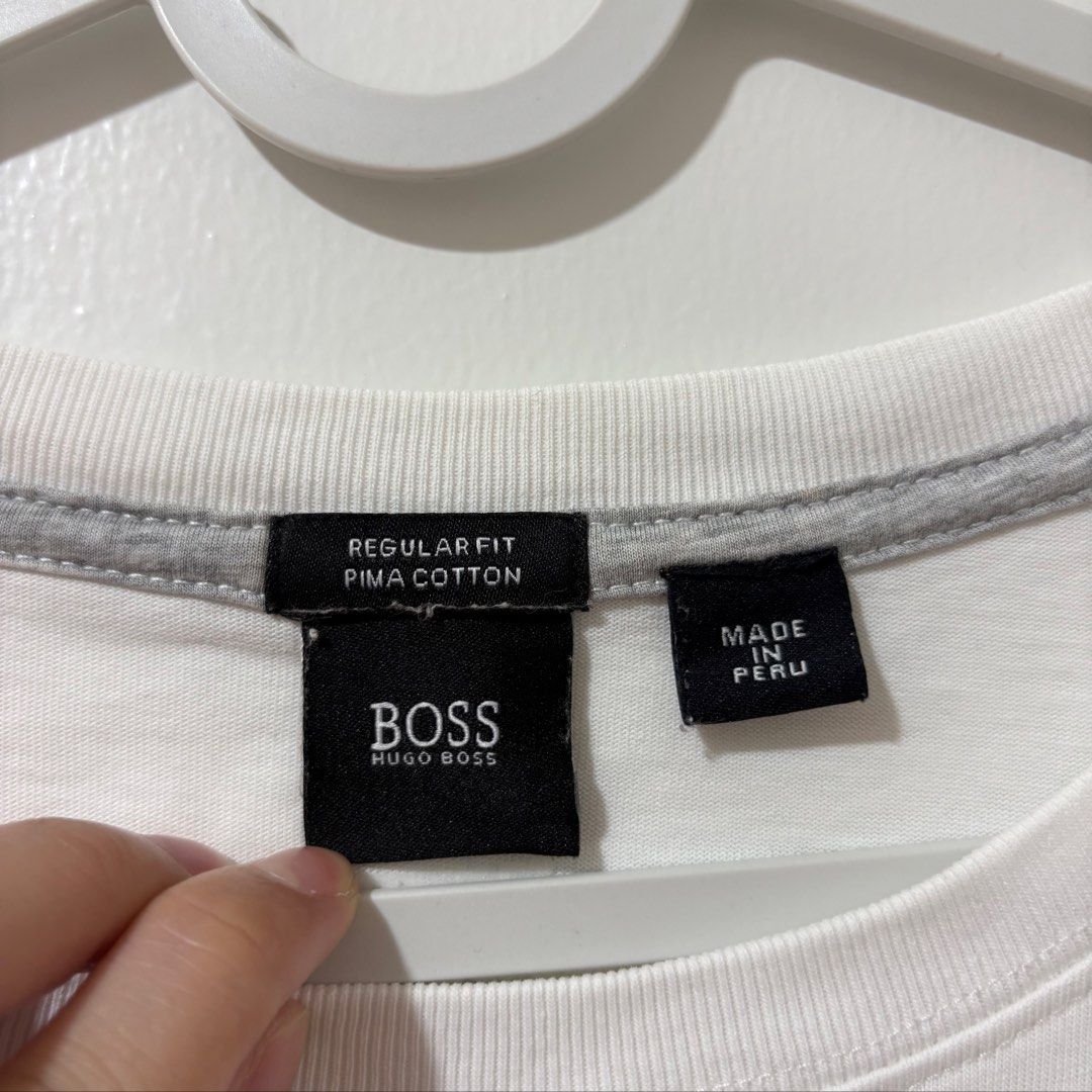 Hugo Boss Minimalist White Shirt (Category: Tshirts & Polo Shirts ) located in Bulacan. Submitted by laleesa_ (Listing ID 1469447313, Image 3). Description: Large-XL Men Issue: Pinhole (see last pic).