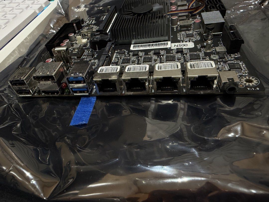 Intel N100 NAS Motherboard with Quad LAN (Category: Desktops) located in Roxas City. Submitted by keso.12 (Listing ID 1469499350, Image 2). Description: - Processor: Built-in Intel N100 CPU - Cooling: Includes active cooler fan attached to heatsink - Network: 4x Quad Ethernet ports on rear I/O - Storage: Multiple SATA ports for hard drives and SSDs - Connectivity: USB ports and audio jack included - Extras: Comes with original I/O shield plate - 