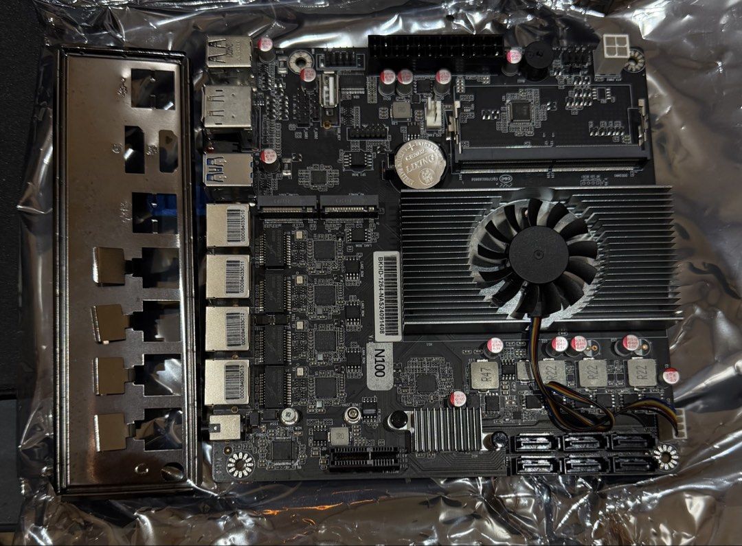 Intel N100 NAS Motherboard with Quad LAN (Category: Desktops) located in Roxas City. Submitted by keso.12 (Listing ID 1469499350, Image 1). Description: - Processor: Built-in Intel N100 CPU - Cooling: Includes active cooler fan attached to heatsink - Network: 4x Quad Ethernet ports on rear I/O - Storage: Multiple SATA ports for hard drives and SSDs - Connectivity: USB ports and audio jack included - Extras: Comes with original I/O shield plate - 