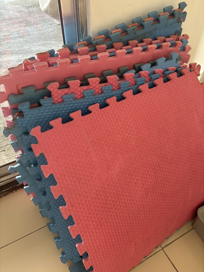 Interlocking foam play mats pink and blue puzzle flooring (Category: Infant Playtime) located in Quezon City. Submitted by ulan-declutter (Listing ID 1469570871, Image 1). Description: - Set of interlocking foam puzzle mats in pink and blue - Versatile use for kids' play areas, home gyms, or workshops - Easy to connect, disconnect, and clean - Bundle includes several pieces (Just needs cleaning and 2 mats were cut in 2).