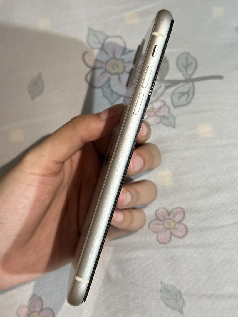 iphone 11 (Category: iPhone 11 Series) located in Quezon City. Submitted by prelovedbyeline_ (Listing ID 1469521611, Image 2). Description: IPHONE 11 | 128GB | WHITE • Preloved, Good condition & well-maintained • 100% battery health (recently replaced) • All buttons, volume, speaker, mic & camera working • Issue is minimal camera paint chipping (see actual photos) • RFS - will upgrade Inclusions: Box, case, brand-new tempered glass Meet-up: SM No