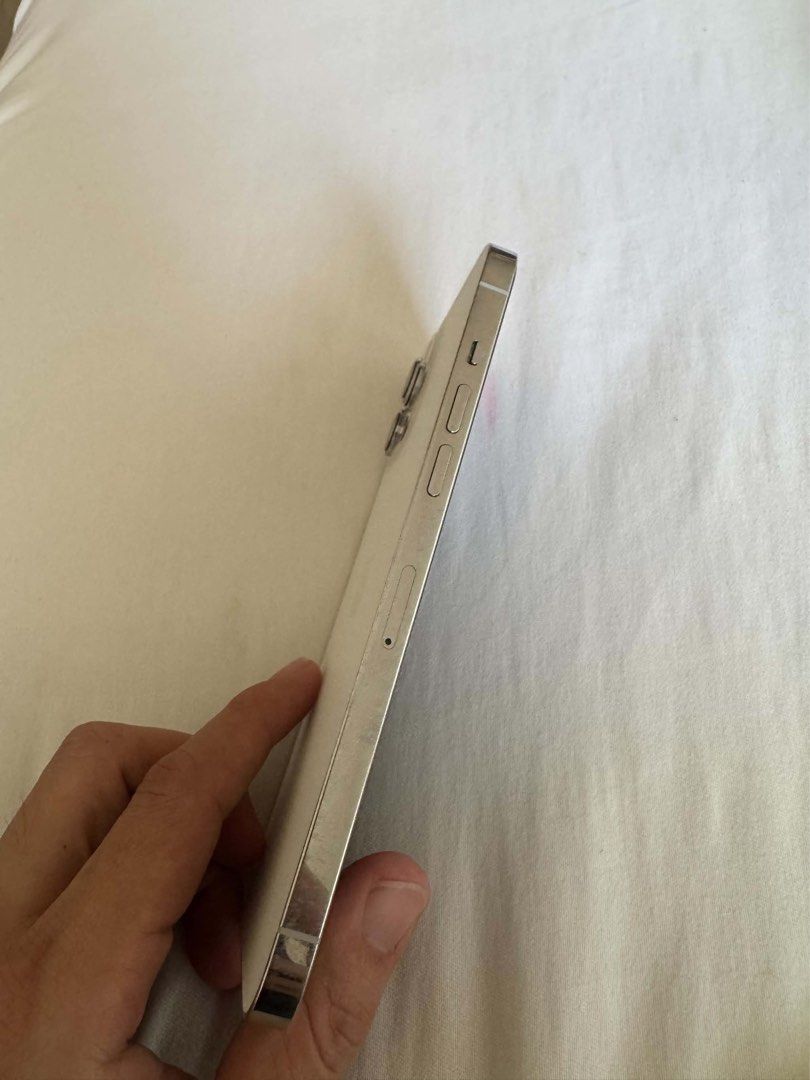 Iphone 12 pro max (Category: iPhone 12 Series) located in Manila. Submitted by brahma806 (Listing ID 1469462924, Image 2). Description: Iphone 12 pro max 128gb White 77% battery health Openline All original parts. Wala pa napapalitan.