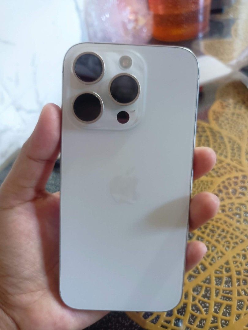 iPhone 15 Pro white Titanium, 128GB (Category: iPhone 15 Series) located in Manila. Submitted by luxewant (Listing ID 1469532040, Image 3). Description: Selling my iPhone 15 Pro in white Titanium, 128GB, 100% Makinis, madaming kasamang Cases, Batt health 83%, matagal pa malowbat, could still last a day depending on how you use it, no icloud problems, you can reset all you want, slightly negotiable, with Box. Di lang kasama Charger. Pwede din swap