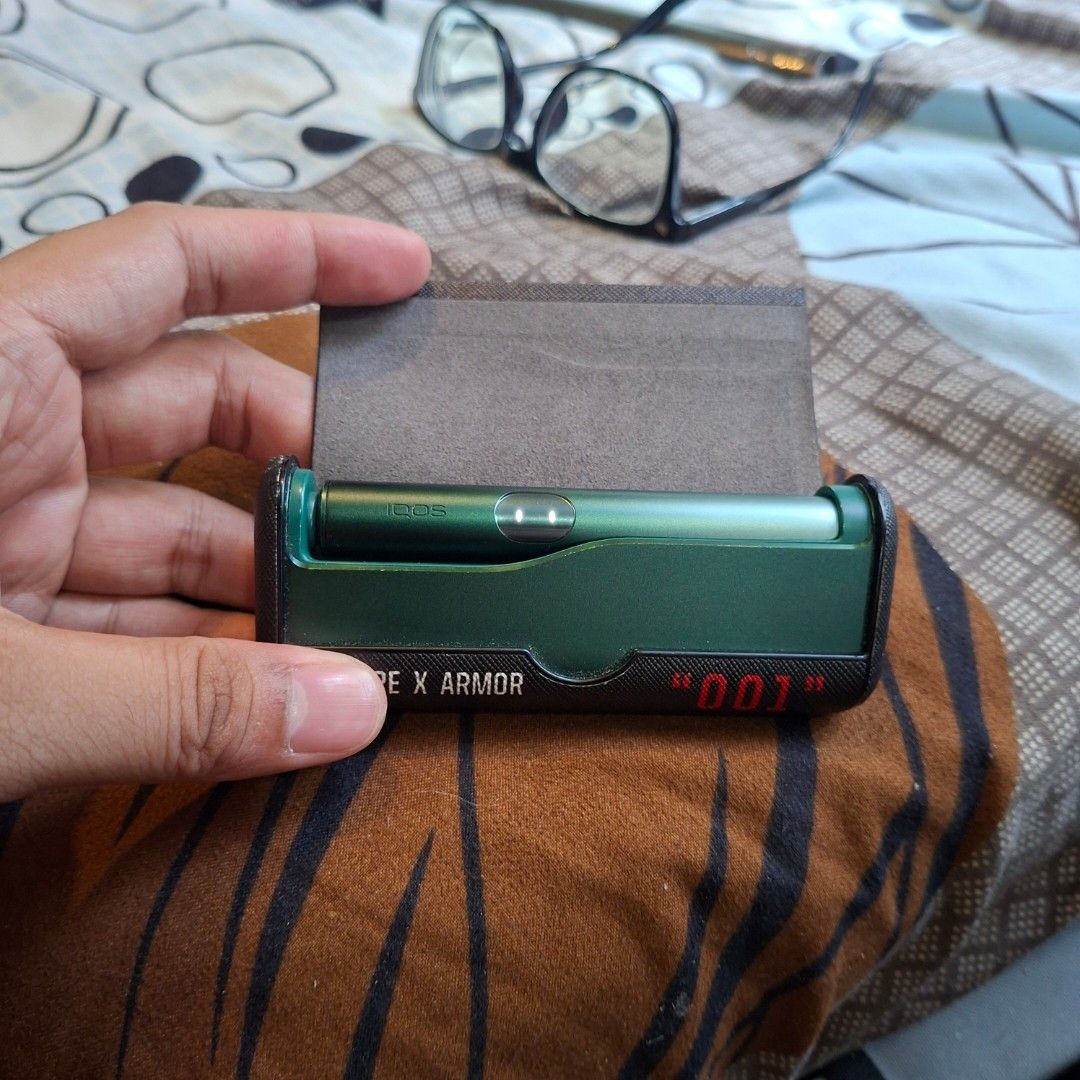 IQOS device green (Category: Other Accessories) located in Manila. Submitted by ralphdominique (Listing ID 1469485783, Image 1). Description: Iluma i prime with free case black case and magnetic cover green leather magnetic cover was unused.