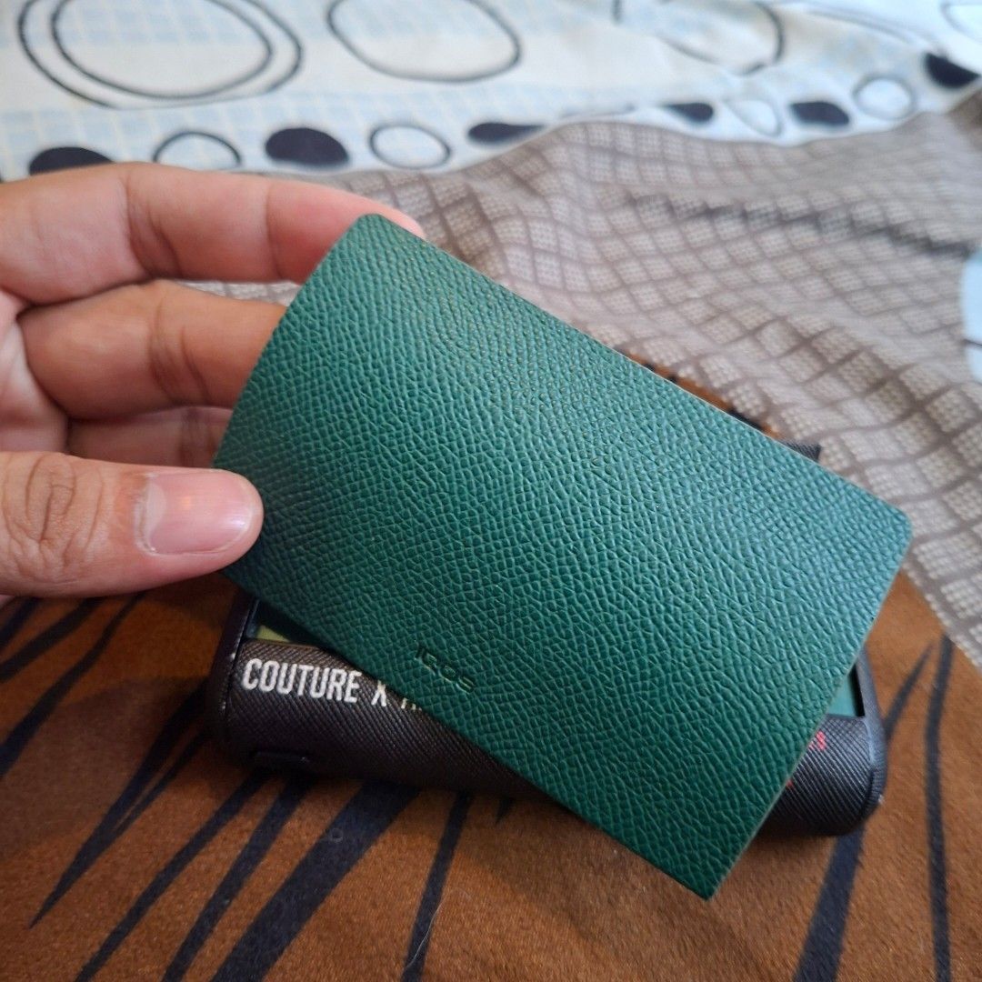 IQOS device green (Category: Other Accessories) located in Manila. Submitted by ralphdominique (Listing ID 1469485783, Image 2). Description: Iluma i prime with free case black case and magnetic cover green leather magnetic cover was unused.