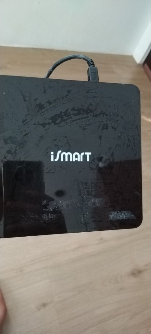 iSmart External DVDRW (Category: Hard Disks & Thumbdrives) located in Quezon City. Submitted by mdmedz (Listing ID 1469514176, Image 3). Description: Selling a working Black iSmart external optical disk drive (Model: ACISM-EDVDRWBK-AT) with attached USB cable. Supports DVD multi recording and CD rewriting. Has minor smudge marks and light wear from storage, but tested and works normally. Can write on DvDs and CDs.
