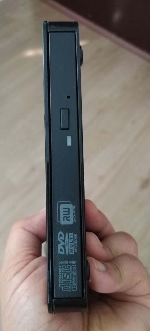 iSmart External DVDRW (Category: Hard Disks & Thumbdrives) located in Quezon City. Submitted by mdmedz (Listing ID 1469514176, Image 2). Description: Selling a working Black iSmart external optical disk drive (Model: ACISM-EDVDRWBK-AT) with attached USB cable. Supports DVD multi recording and CD rewriting. Has minor smudge marks and light wear from storage, but tested and works normally. Can write on DvDs and CDs.