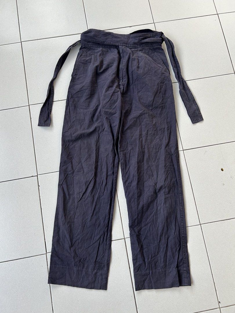 Issey Miyake Men Belted (Category: Trousers) located in Angeles City. Submitted by cassey_phoenix (Listing ID 1469469323, Image 1). Description: - Brand: Issey Miyake Men (LG44558) - Color: burgundy - Size: Medium (M) - Material: 100% Cotton (Made in Japan) - Fit: Straight wide leg cut with pleated front - Features: Integrated waist tie belt - Manufacturer: Issey Miyake International - Condition: Pristine, ready to wear.