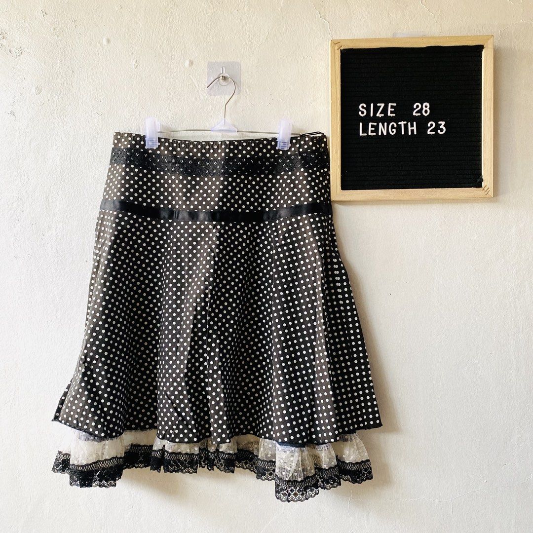 IVE Polka Dot Skirt with Lace Hem (Category: Skirts) located in Caloocan City. Submitted by lovemyclothes21 (Listing ID 1469407091, Image 1). Description: - Color & Pattern: Black with white polka dots - Design: Layered style with delicate lace trim at the hem and a black ribbon detail - Material: Comfortable cotton and elastane blend - Size: 28-inch waist - Length: 23 inches - Condition: Excellent, highly-rated seller assurance - Perfect for: Ca