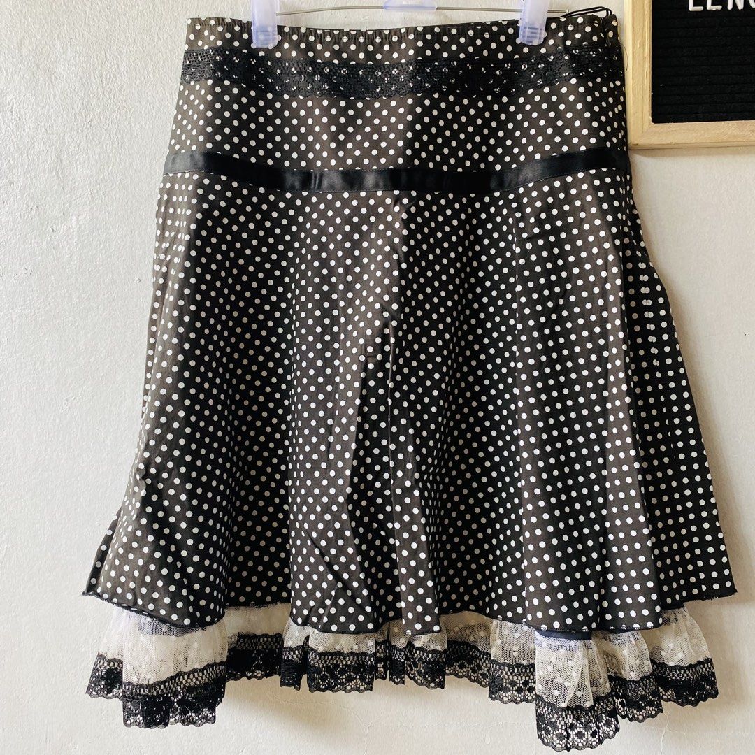 IVE Polka Dot Skirt with Lace Hem (Category: Skirts) located in Caloocan City. Submitted by lovemyclothes21 (Listing ID 1469407091, Image 2). Description: - Color & Pattern: Black with white polka dots - Design: Layered style with delicate lace trim at the hem and a black ribbon detail - Material: Comfortable cotton and elastane blend - Size: 28-inch waist - Length: 23 inches - Condition: Excellent, highly-rated seller assurance - Perfect for: Ca