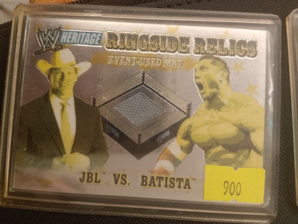 JBL VS BATISTA (Category: Raw Singles) located in San Juan City. Submitted by jim.jim7 (Listing ID 1469413789, Image 1). Description: - WWE Heritage Ringside Relics trading card featuring JBL and Batista - Contains an authentic, event-used ring mat piece embedded in the card - Comes safely stored inside a protective top loader plastic case - Ideal collectible piece for wrestling fans and trading card hobbyists - Condition: Well-kept and ready for