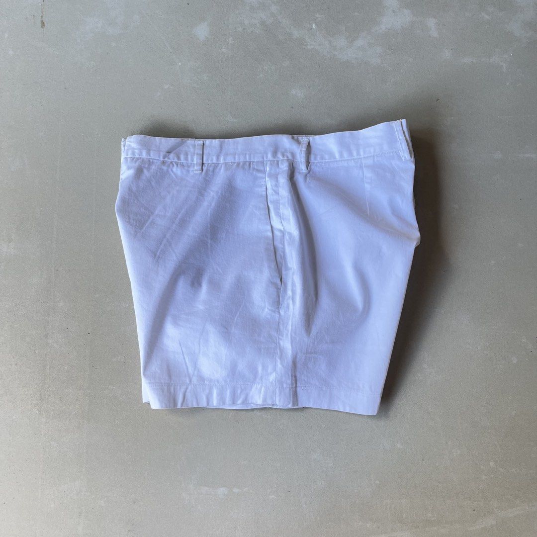 Jil Sander White Shorts (Category: Shorts) located in Mandaue City. Submitted by chinsyap_03 (Listing ID 1469468216, Image 2). Description: - Brand: Jil Sander - Color: Solid White - Material: Crisp cotton - Style: Minimalist cut with zip fly, button closure, and belt loops - Pockets: Front pockets and single buttoned back pocket - Measurements: Waist 28 inches, Length 13 inches - Condition: Excellent overall shape, very clean fabric.