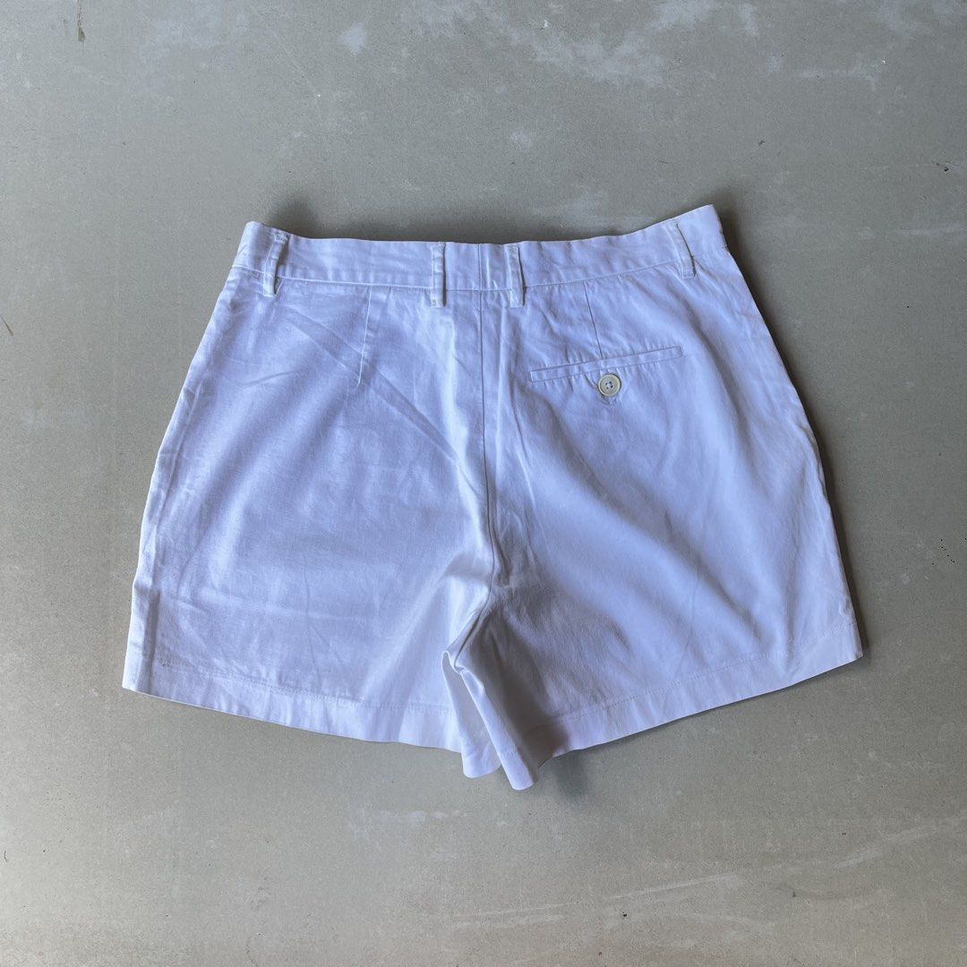 Jil Sander White Shorts (Category: Shorts) located in Mandaue City. Submitted by chinsyap_03 (Listing ID 1469468216, Image 3). Description: - Brand: Jil Sander - Color: Solid White - Material: Crisp cotton - Style: Minimalist cut with zip fly, button closure, and belt loops - Pockets: Front pockets and single buttoned back pocket - Measurements: Waist 28 inches, Length 13 inches - Condition: Excellent overall shape, very clean fabric.