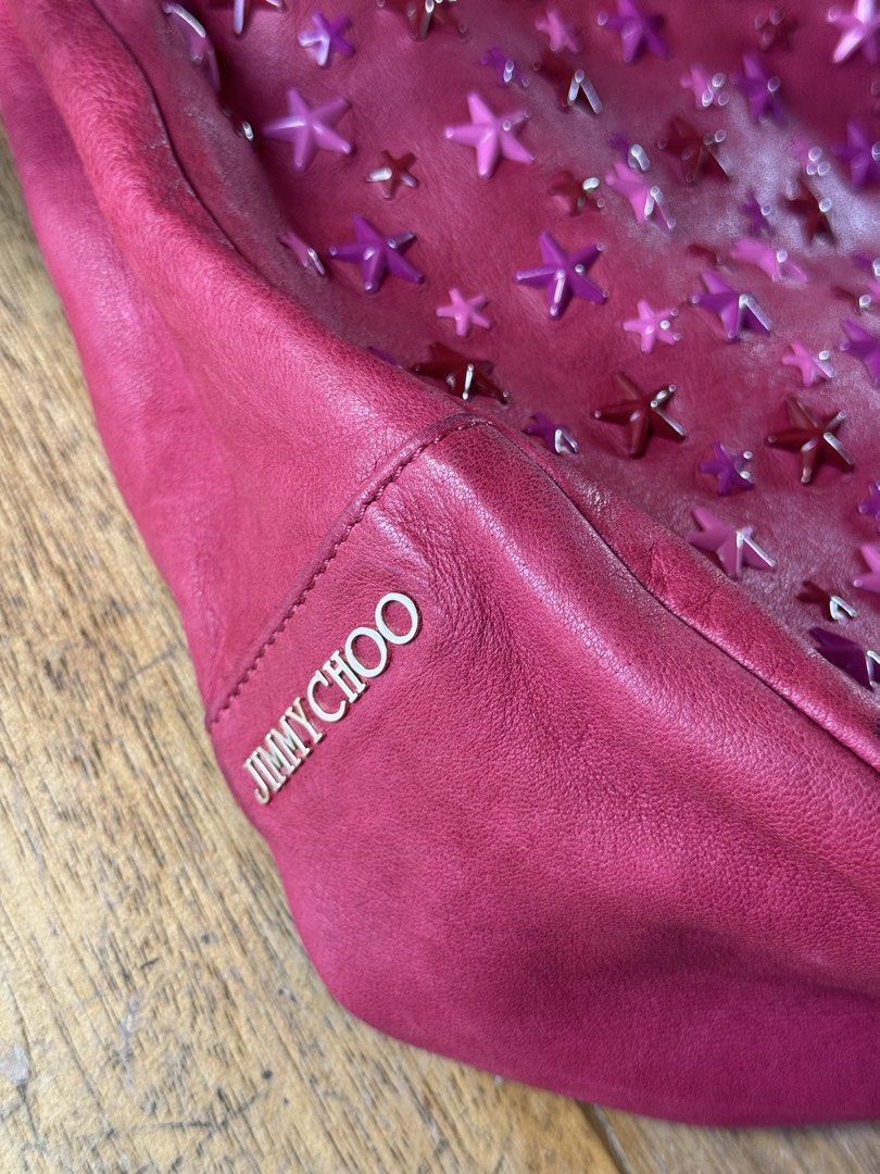 JIMMY CHOO Sky Hobo (Category: Luxury Bags & Wallets) located in Davao. Submitted by _iconculture (Listing ID 1469524923, Image 2). Description: AVAILABLE • JIMMY CHOO Sky Hobo ★ She’s basically THE OUTFIT. A true eye-catcher, adorned with star embellishments from the late 2000s. Originally debuted in the Fall/Winter 2008 collection. Condition: 9/10 — Very good overall condition. Has some dirt marks and darkening on the leather consistent with ag