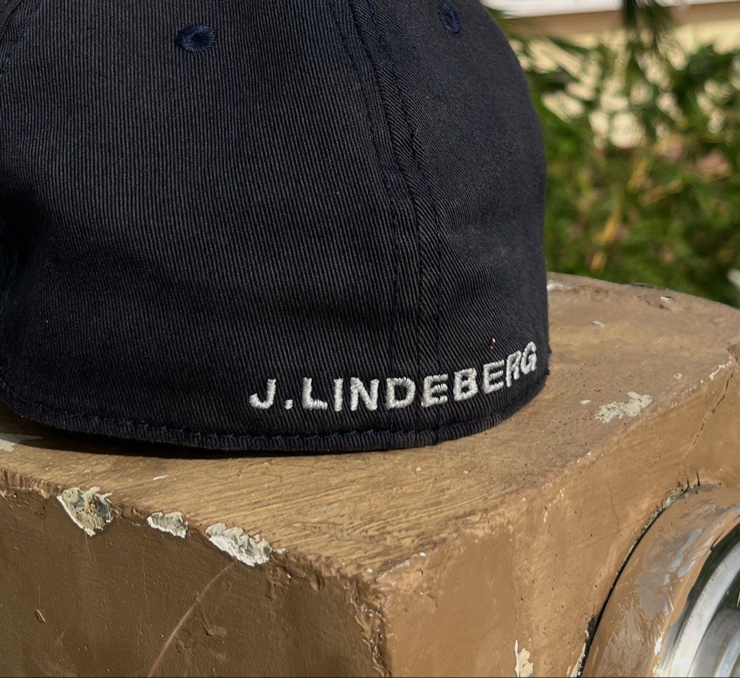 j.lindeberg Black Baseball Cap (Category: Caps & Hats) located in Pontevedra. Submitted by thrift01 (Listing ID 1469572041, Image 3). Description: - Brand: J.Lindeberg - Color: Black - Design: Iconic silver Bridge logo embroidered on front, brand name on back - Fit: Clean structured crown with curved visor - Details: Branded interior sweatband lining, made in China - Perfect for: Golf, sports, and casual everyday wear.
