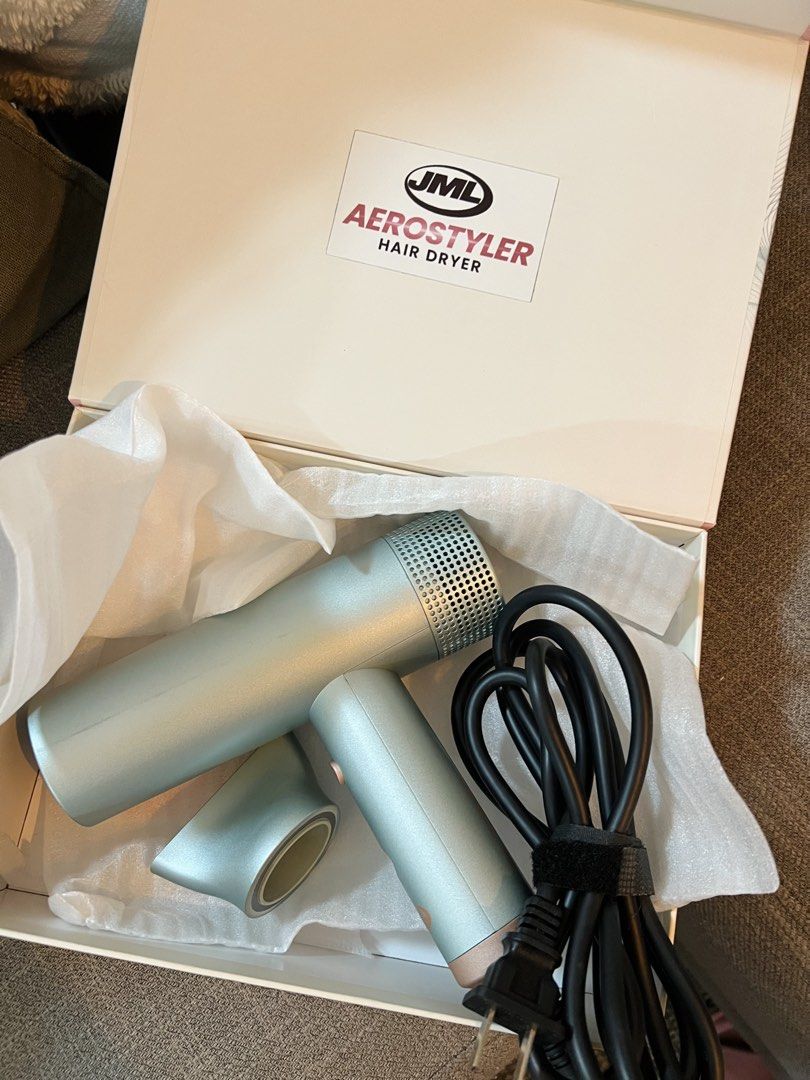 JML Aero Styler Hair Dryer (Category: Hair) located in Taguig. Submitted by littlejamillescloset (Listing ID 1469559526, Image 2). Description: - Brand: JML Aero Styler hair dryer - Condition: Like new with light scratches, used 2-5x, bought in 2024 - Inclusions: Detachable styling nozzle and power cord with velcro strap - Retail Price: Over 3,000 PHP in local stores - Perfect for daily blowouts and styling routines.