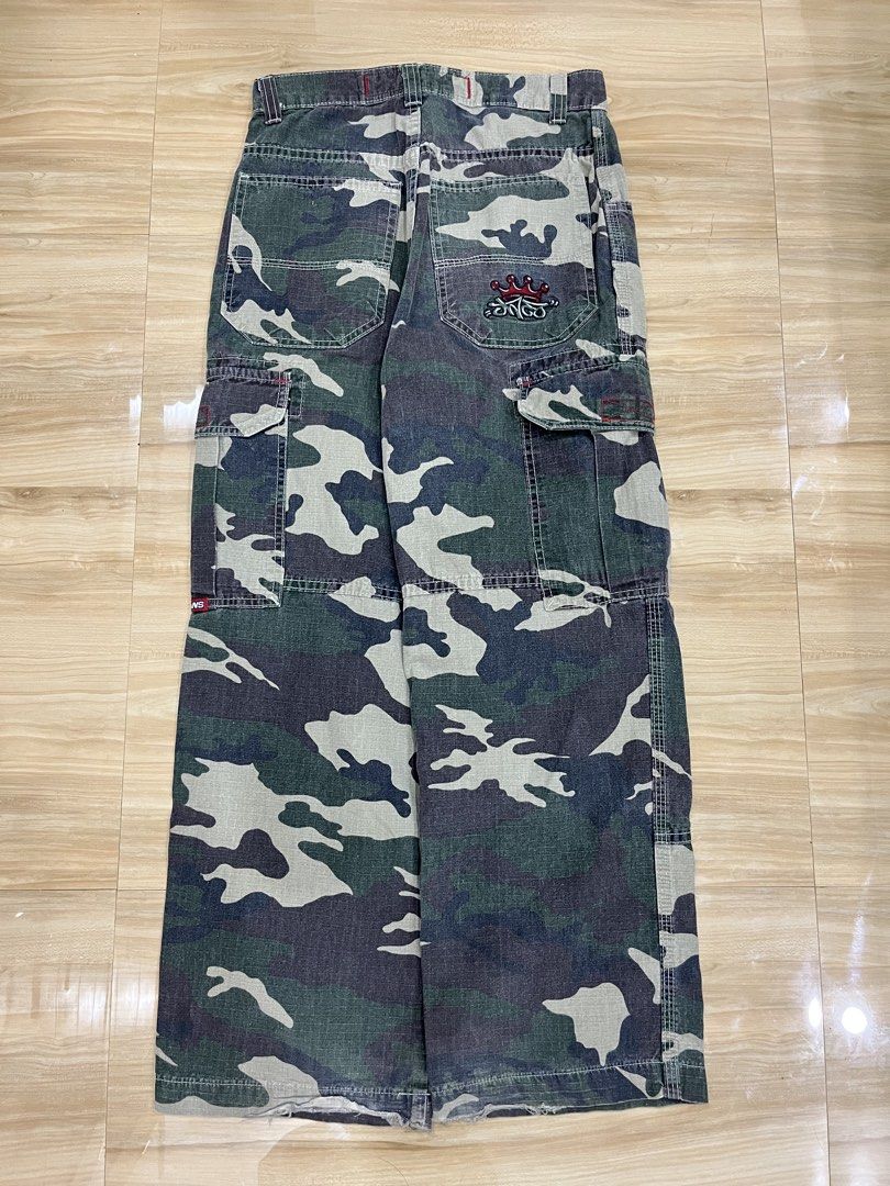 JNCO Jeans Camouflage Cargo Pants (Category: Jeans) located in Angeles City. Submitted by thriftsij (Listing ID 1469542613, Image 1). Description: -JNCO CARGO CAMOFLAUGE -5500 Free Shipping Obo -W28L38T11LO9 - Design: Green camouflage print with classic cargo style - Details: Multiple side pockets, utility loops, and iconic embroidered crown logo on the back pocket - Branding: Red woven JNCO labels on the side and waistband interior - Origin: Ass