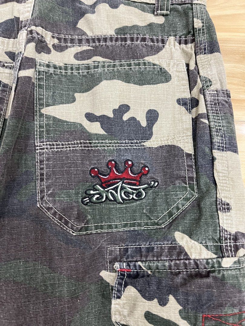 JNCO Jeans Camouflage Cargo Pants (Category: Jeans) located in Angeles City. Submitted by thriftsij (Listing ID 1469542613, Image 3). Description: -JNCO CARGO CAMOFLAUGE -5500 Free Shipping Obo -W28L38T11LO9 - Design: Green camouflage print with classic cargo style - Details: Multiple side pockets, utility loops, and iconic embroidered crown logo on the back pocket - Branding: Red woven JNCO labels on the side and waistband interior - Origin: Ass