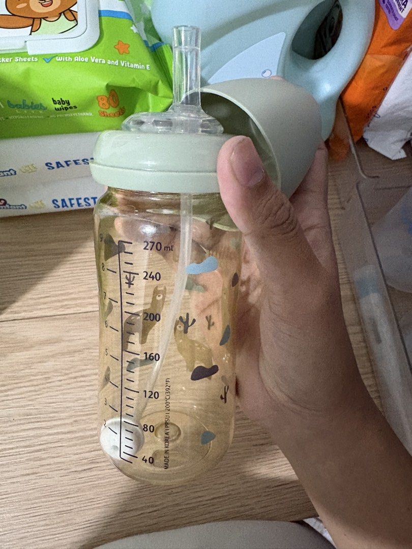 Jollibaby PPSU Straw Bottle and Nurture Bottles Bundle (Category: Breastfeeding & Bottle Feeding) located in Manila. Submitted by chamendoza79060 (Listing ID 1469550693, Image 2). Description: - Bundle of 3 clear plastic baby feeding bottles in great, clean condition - 1x Jollibaby straw bottle (270ml capacity) featuring adorable llama prints - 2x Nurture baby bottles with secure blue caps and nipple attachments - Includes clear measurement marki