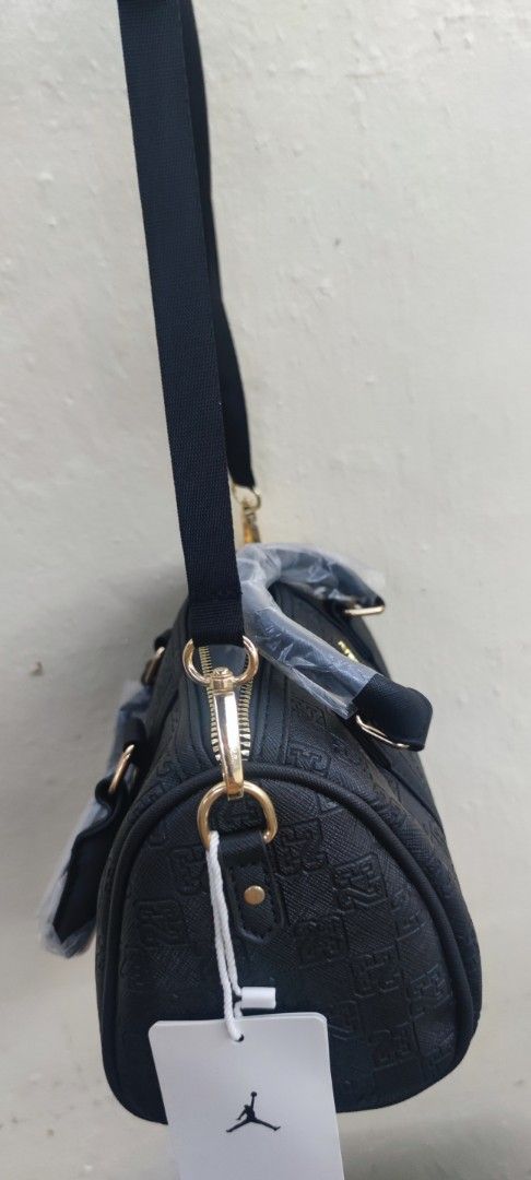 Jordan Black Monogram Crossbody Handbag (Category: Cross-body Bags) located in Manila. Submitted by michateng246031 (Listing ID 1469465366, Image 2). Description: - Authentic Black Jordan handbag with all-over embossed 23 monogram pattern - Elegant gold-tone hardware featuring a front Jumpman logo - Dual top grab handles (still wrapped in protective plastic) - Includes an adjustable and detachable black shoulder strap - Brand new with original ta