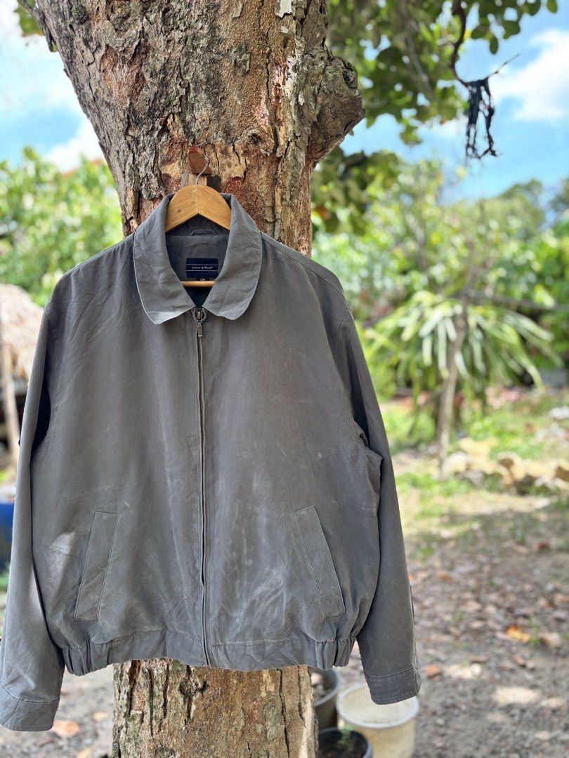 Joseph & Feiss Gray Zip Up Jacket Size L (Category: Coats, Jackets and Outerwear) located in San Jacinto. Submitted by ticao_thrift (Listing ID 1469571739, Image 2). Description: - Brand: Joseph & Feiss - Color: Gray - Size: L/G - Design: Classic collared zip-up jacket with full metal zipper closure - Features: Front pockets, elastic hem, and smooth inner lining with branded tape detail - Condition: Excellent, ready to wear.