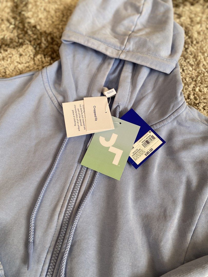 JoyLab Cropped Zip-Up Hoodie Hydrangea Blue (Category: Coats, Jackets and Outerwear) located in Batangas. Submitted by lux_kimmy (Listing ID 1469421901, Image 3). Description: - Brand: JoyLab - Item: Cropped zip-up hoodie - Color: Hydrangea blue - Size: Extra Small (XS) - Condition: Brand new with original retail tags - Original Price: $30 (approx. ₱1,750) - Features: Super soft fabric, raw-edge seam details, drawstring hood, and front pockets.