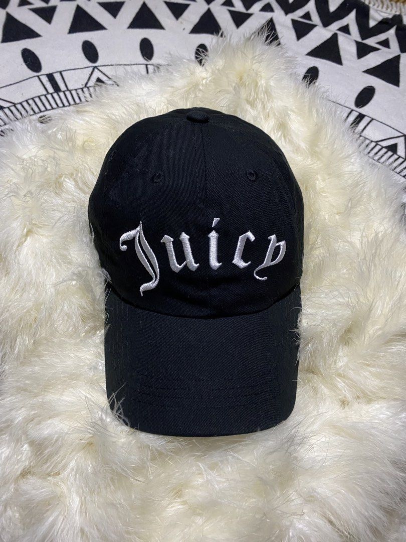 Juicy Couture Black Juicy Forever Cap (Category: Caps & Hats) located in Badiangan. Submitted by iralorana.thrift (Listing ID 1469419222, Image 2). Description: - Brand: Juicy Couture - Color: Classic black with white embroidery - Details: 'Juicy' script on front, 'Juicy Couture FOREVER' on the back - Size: One size fits most (approx. 56 cm circumference) - Material: 100% cotton with fabric care tag inside - Fit: Adjustable strap closure in back 