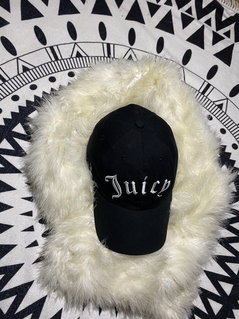 Juicy Couture Black Juicy Forever Cap (Category: Caps & Hats) located in Badiangan. Submitted by iralorana.thrift (Listing ID 1469419222, Image 1). Description: - Brand: Juicy Couture - Color: Classic black with white embroidery - Details: 'Juicy' script on front, 'Juicy Couture FOREVER' on the back - Size: One size fits most (approx. 56 cm circumference) - Material: 100% cotton with fabric care tag inside - Fit: Adjustable strap closure in back 