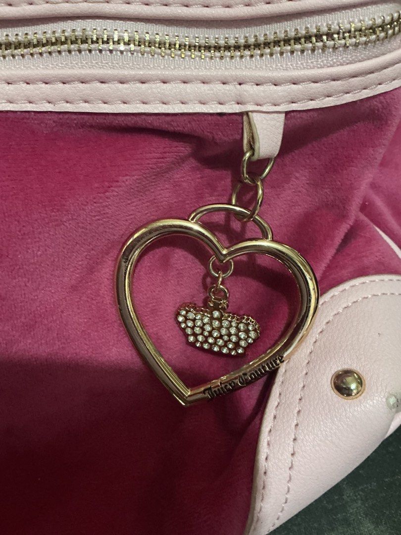 Juicy Couture Royal Velour Backpack Pink (Category: Backpacks) located in Santa Barbara. Submitted by user82739292 (Listing ID 1469441447, Image 3). Description: - Juicy Couture velour backpack in deep pink - Features signature rhinestone crown logo and embroidered text - Accentuated with light pink trim and corners - Premium gold-tone hardware with a cute heart-shaped zipper charm - Soft texture with a spacious main compartment - Perfect for dai