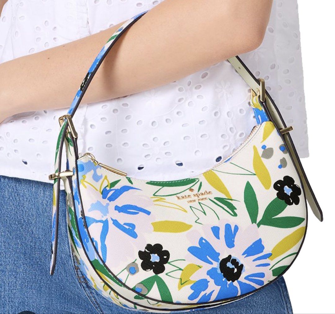 Kate Spade Floral Crescent Shoulder Bag (Category: Shoulder Bags) located in Rizal. Submitted by gannda (Listing ID 1469440625, Image 3). Description: - Brand: Kate Spade - Condition: Brand new with tags (never used) - Design: Blue & yellow floral pattern on off-white - Style: Curved crescent shoulder bag - Hardware: Gold-tone - Closure: Top zip - Strap: Includes detachable & adjustable matching strap for crossbody wear - with paper bag or box.