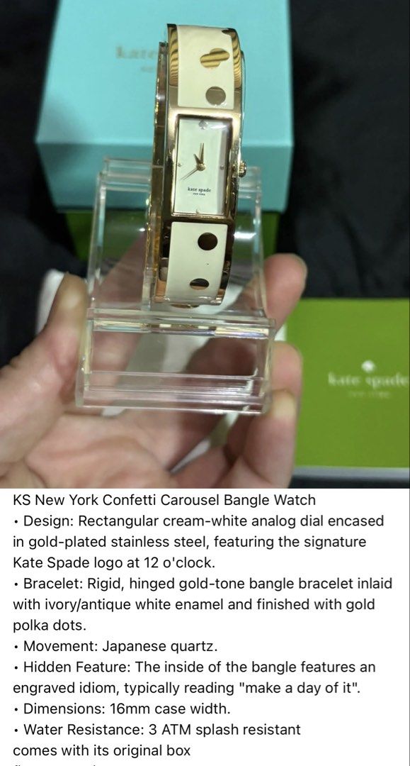 Kate Spade New York Confetti Carousel Bangle Watch (Category: Women's Watches) located in Caloocan City. Submitted by berndale_closet (Listing ID 1469570041, Image 1). Description: - Brand: Kate Spade New York (Confetti Carousel Bangle Watch) - Dial: Rectangular cream-white analog with signature spade logo at 12 o'clock - Case: Gold-plated stainless steel (16mm width) - Strap: Rigid hinged gold-tone bangle inlaid with ivory enamel and gold polka 